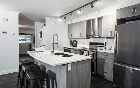 Condo | Private kitchen | Full-size fridge, microwave, oven, stovetop - Novlan Suite by Revelstoke Vacations (Revelstoke)