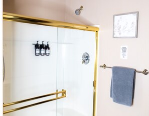 Combined shower/tub, hair dryer, towels, soap
