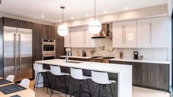 Fridge, coffee/tea maker, cookware/dishes/utensils