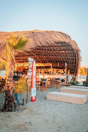Dine al fresco at this beachfront restaurant, offering a variety of seating options and a relaxed atmosphere.