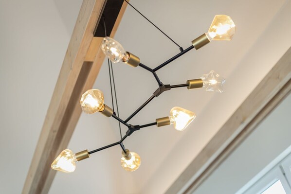A modern chandelier with multiple light bulbs.