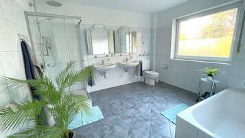 Bathtub, hair dryer, towels