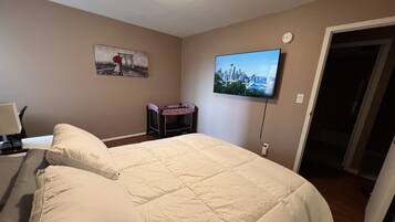 1 bedroom, desk, iron/ironing board, travel crib