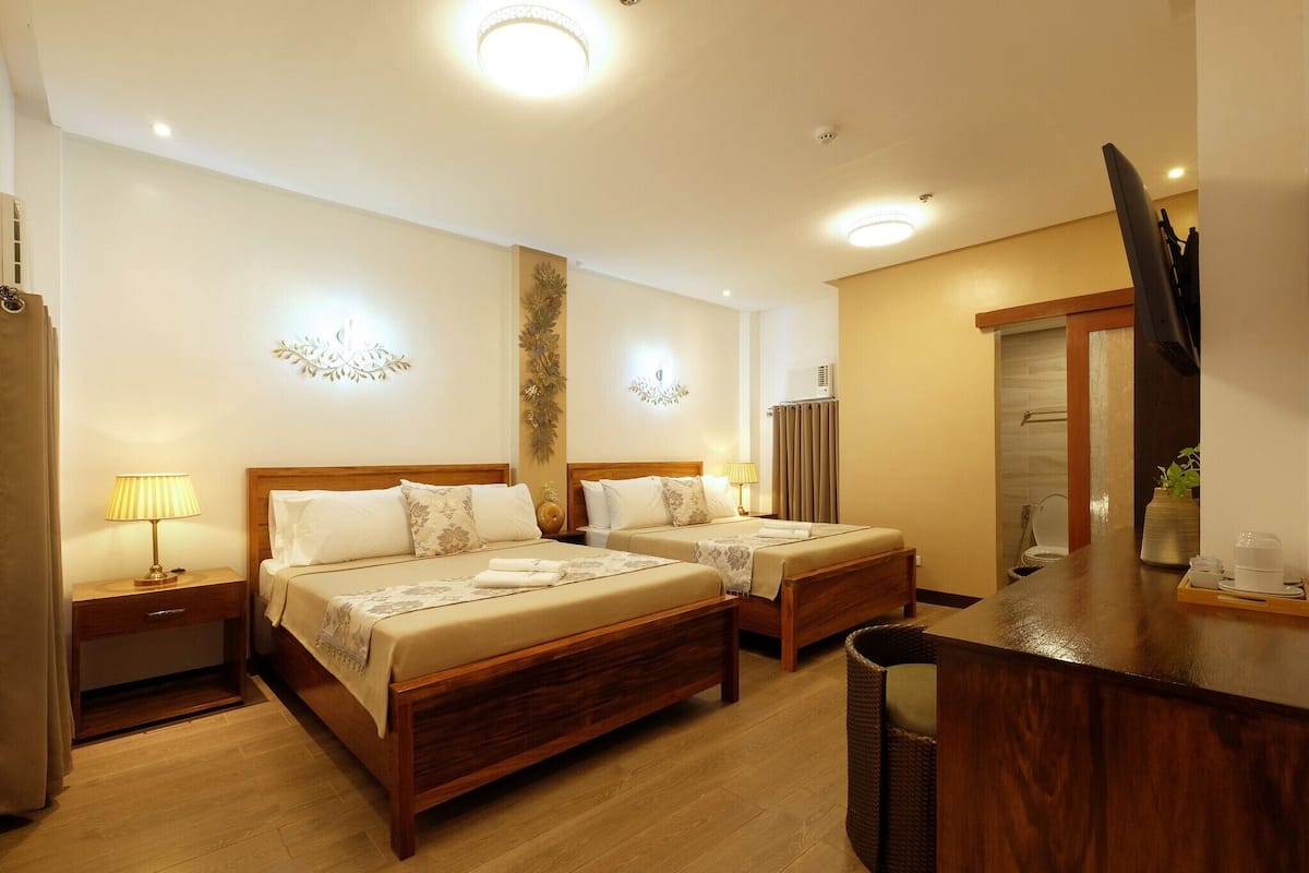 Family Room, 2 Queen Beds | 1 bedroom, in-room safe, individually decorated, individually furnished
