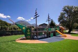 A playground with a slide and climbing structures. - Porto Letizia T11, Porlezza, Italy (Porlezza)