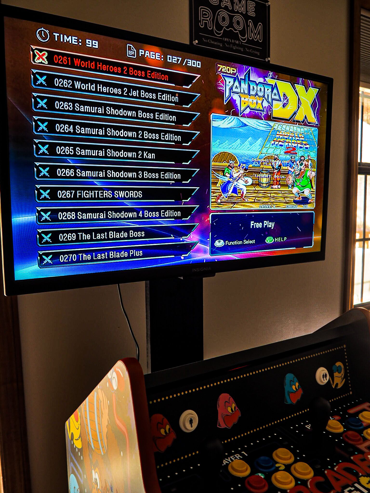 A video game screen with a list of game titles and a "Free Play" button.