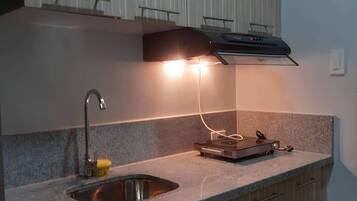 Fridge, microwave, electric kettle, cookware/dishes/utensils