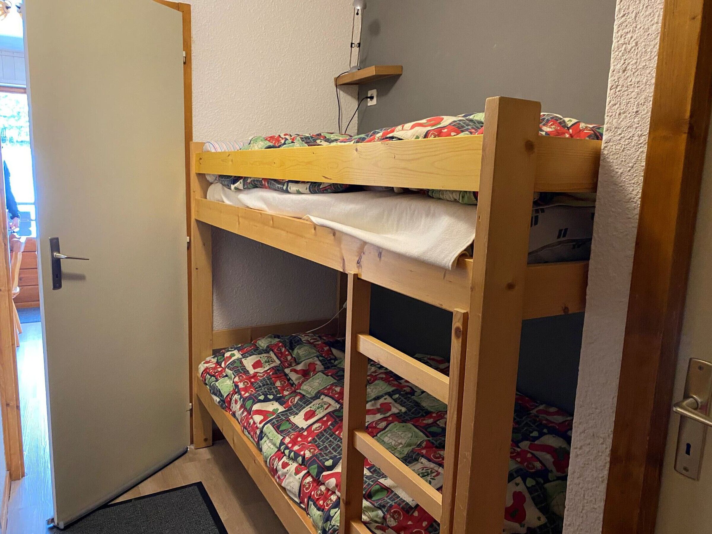 A bunk bed with a lower bunk and a top bunk.