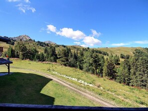 A scenic view of a mountain landscape with a clear sky, a dirt path, and a wooden structure. - Ski-in/Ski-out 1-bedroom apartment, balcony, sleeps 4 (Belle Plagne)