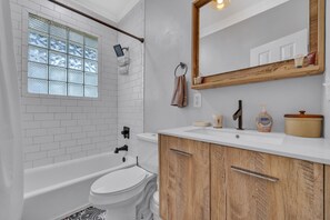 Combined shower/bathtub, hair dryer, towels, soap