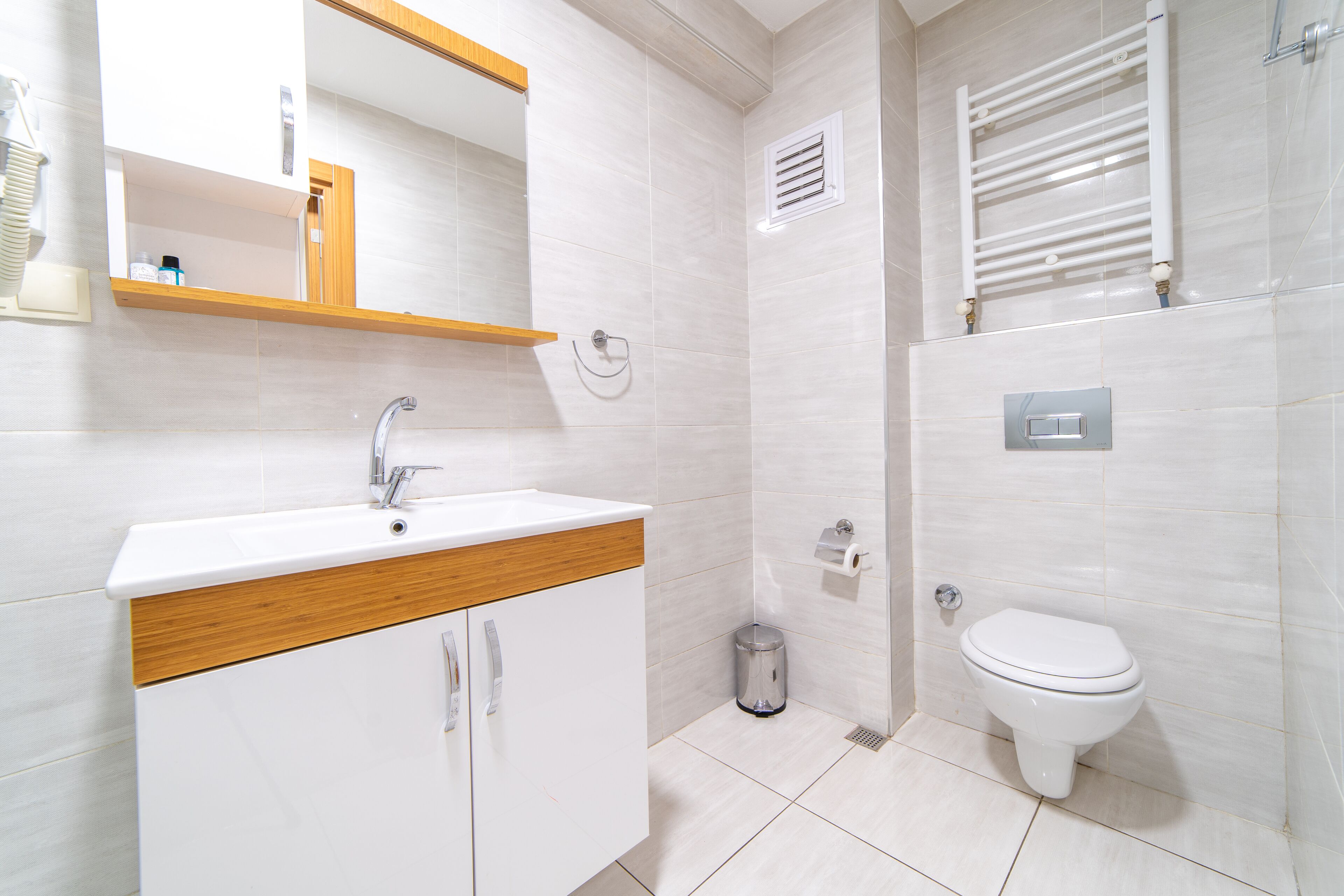 deluxe studio suite | bathroom | shower, rainfall showerhead, hair dryer, heated floors