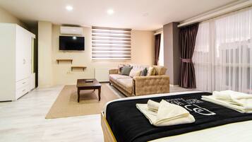 Suite estudio Deluxe | Escritorio, wifi gratis, ropa de cama