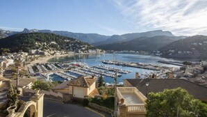 A coastal town with a marina, buildings, and mountains in the background. - Holiday Apartment Ponent with Sea View, Mountain View, Balcony, Terrace & Pool (Puerto de Sóller)