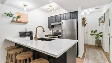 Condo, Multiple Beds, Balcony, Garden View (Midnight Oasis) | Private kitchen | Coffee/tea maker