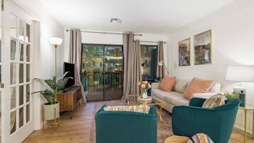 Condo, Multiple Beds, Balcony, Garden View (Midnight Oasis) | Living area | 42-inch flat-screen TV with digital channels