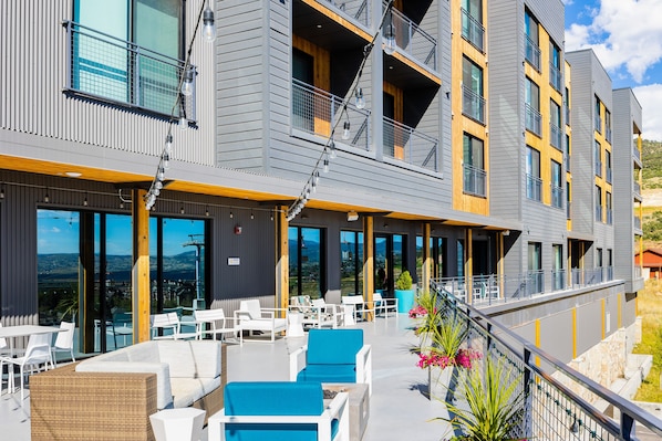 Experience a stylish retreat with large windows, balconies, and comfortable lounge areas.