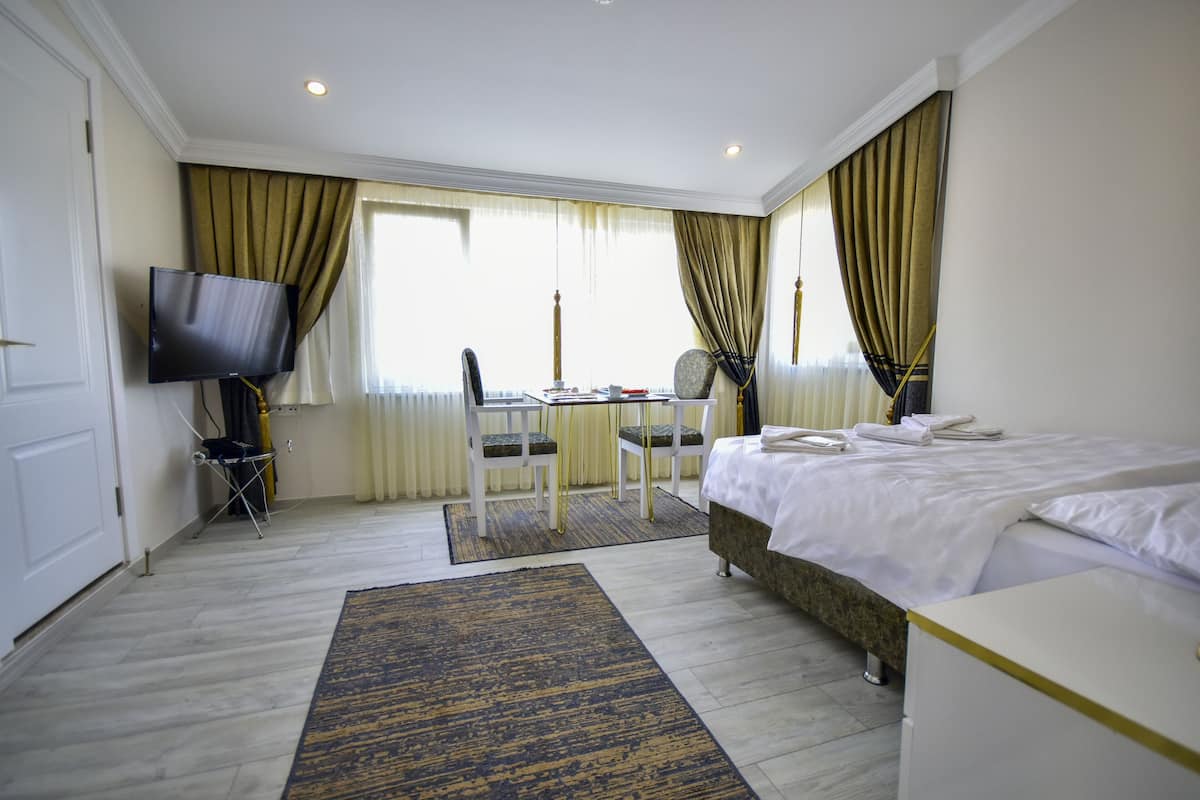 economy studio | premium bedding, down duvets, minibar, individually decorated