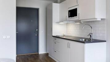 Apartment, 1 Single Bed | Private kitchen | Fridge, microwave, stovetop