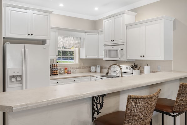 Appartamento, letti multipli, idromassaggio, vista campo da golf | Cucina privata | Frigorifero, microonde, forno, piano cottura