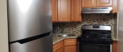 Fridge, microwave, stovetop, coffee/tea maker