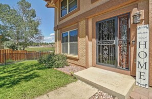 Welcome to our home, surrounded by a beautifully maintained garden and a charming entrance.