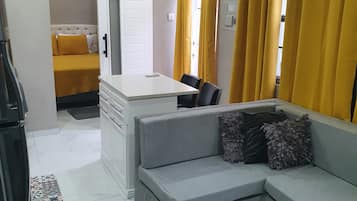 Luxury Apartment | Living area | 42-inch Smart TV with cable channels, TV, printers