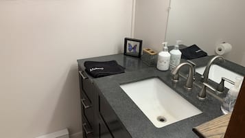 Combined shower/tub, hair dryer, towels, soap