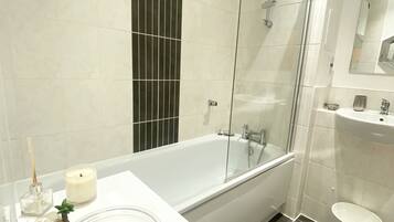Apartment, 1 Queen Bed | Bathroom | Shower, hair dryer, towels