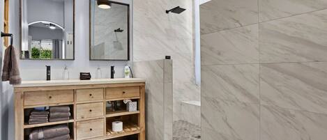 Combined shower/tub, hair dryer, towels, soap
