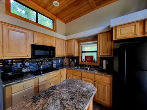 Fridge, microwave, stovetop, coffee/tea maker