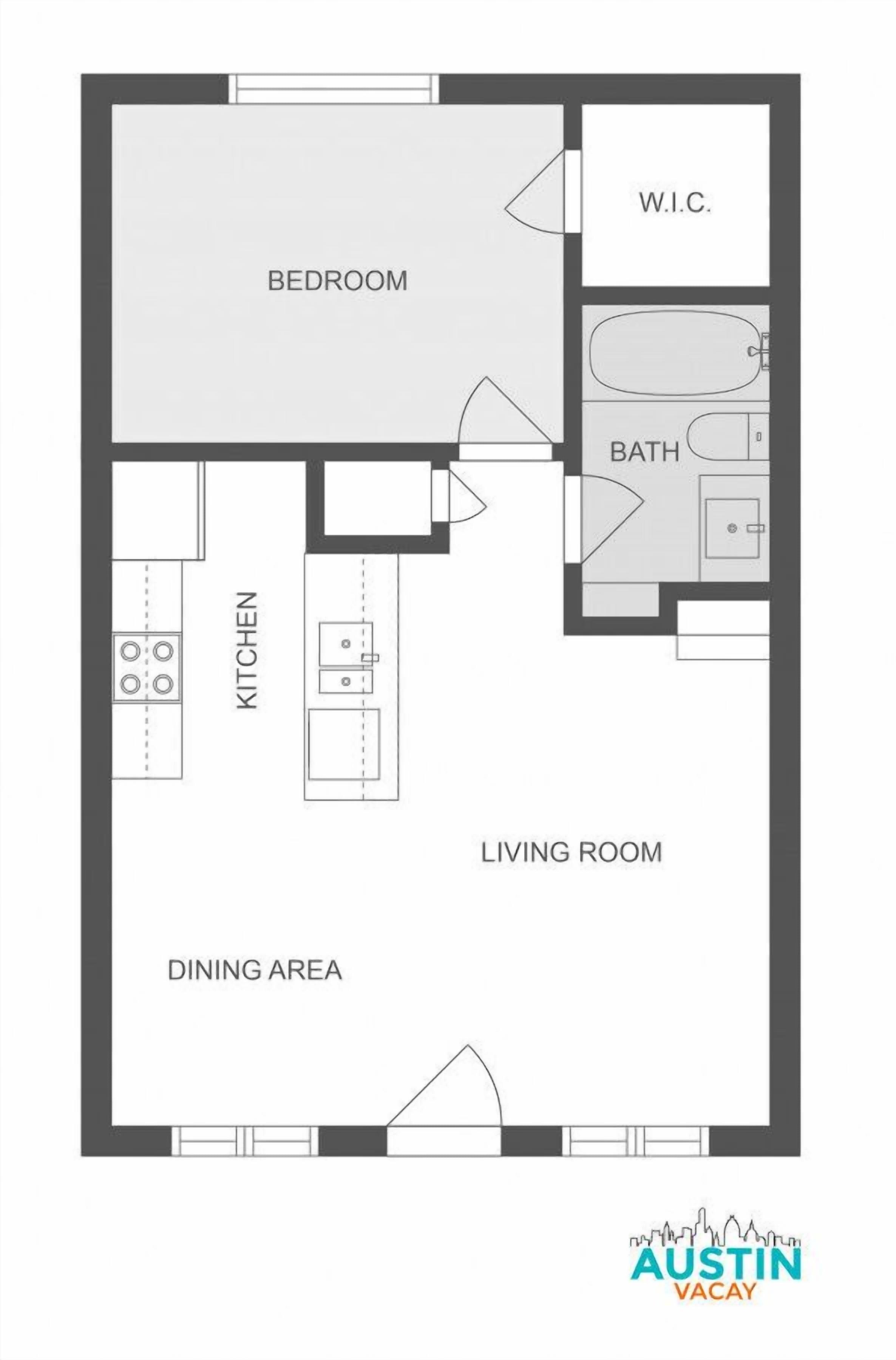 A floor plan of a hotel room with a bedroom, W.C., bathroom, kitchen, dining area, and living room.