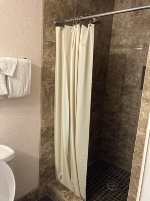 Shower, rainfall showerhead, towels