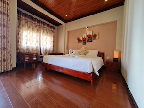 Deluxe Room, City View | Free minibar, in-room safe, desk, laptop workspace