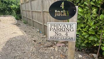 A private parking sign with the number 4 and the name 'Jacky'.