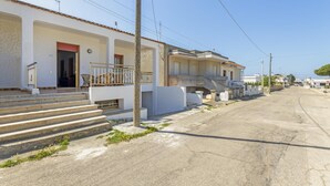 A residential street with white buildings, a visible front door, and steps leading to a balcony. - 2967 Dimora di Lucia by Barbarhouse (Taviano)