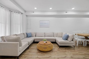 Sink into the inviting embrace of the massive sectional couch, the ultimate gathering spot for TV binging and shared laughter.