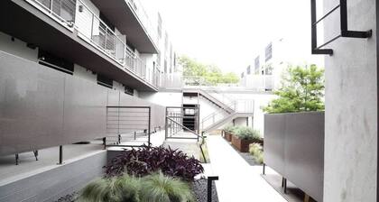 Upscale 2BR Condo w Patio, City Views, Walk to DT