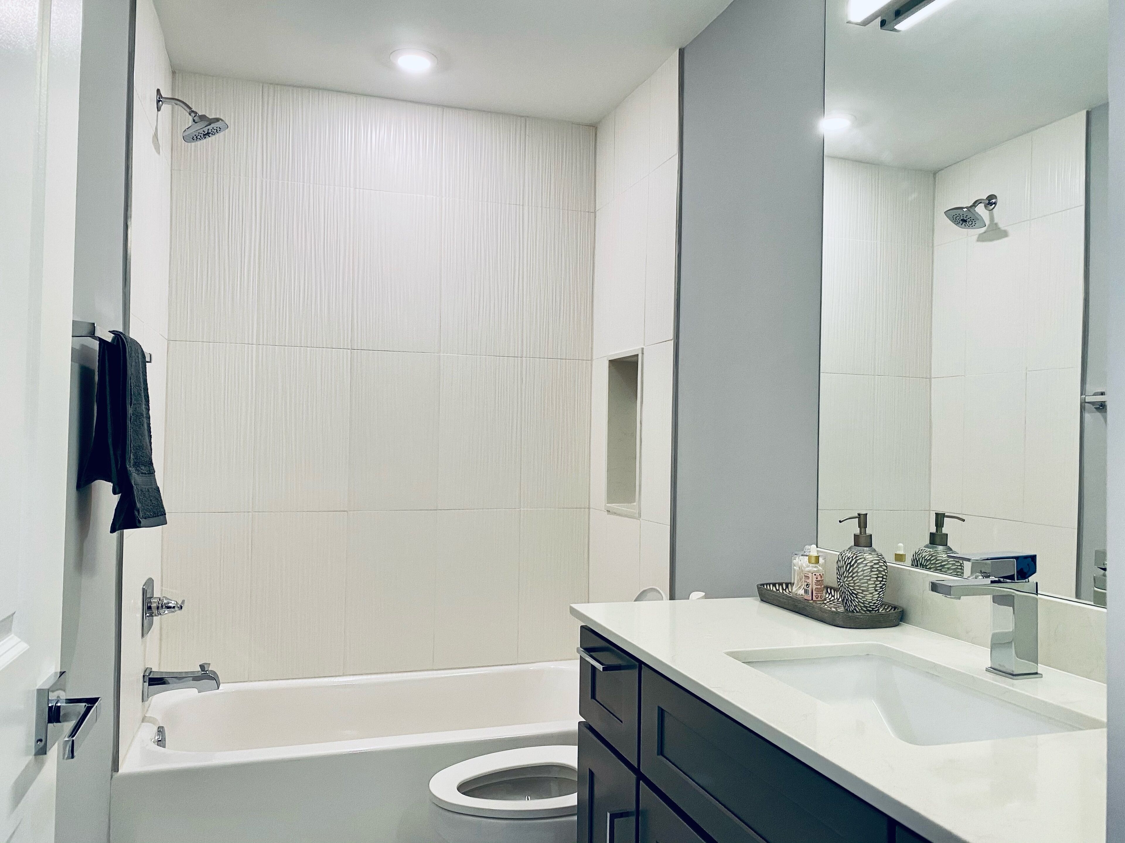 Combined shower/tub, hair dryer, towels, soap