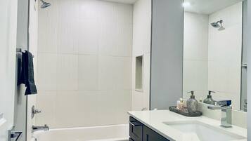 Combined shower/tub, hair dryer, towels, soap