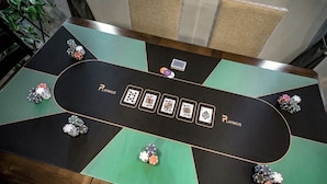 A poker table with chips and playing cards, branded with "PLAYWUS." - Inviting Sunny House! Poker table~ 4br 3ba 7 beds/ 10 mins to Airport & Strip! (Las Vegas)