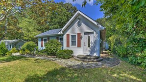 A single-story house with a front porch, a small garden, and a driveway. - Dog-Friendly Waretown Home w/ Furnished Deck! (Waretown)