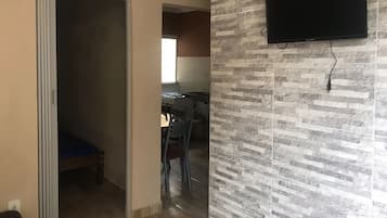 Basic Apartment | Living area | 24-inch TV with digital channels