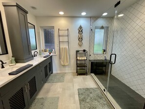 Combined shower/tub, hair dryer, towels, soap