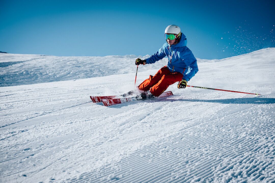 A person skiing on a snowy slope.