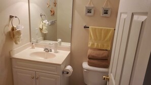 Combined shower/tub, hair dryer, towels, soap
