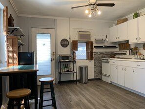 Enjoy cooking and dining in this well-equipped kitchen with a central island, dining area, and bar space.