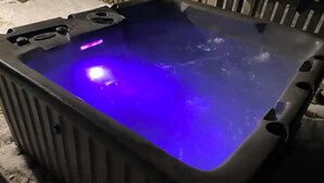A hot tub with a blue light.