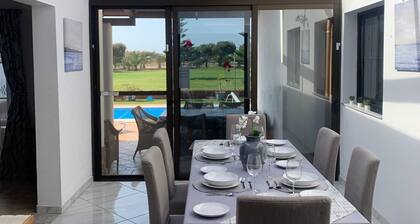 Lovely villa - all day sun, heated private pool with golf views, close to beach