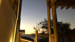 A wooden staircase structure with a clear view of the sky and a crescent moon. - Siriúba Reserve (Ilhabela)