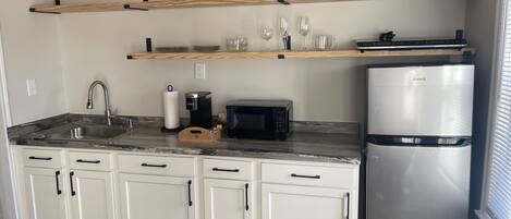 Fridge, microwave, stovetop, coffee/tea maker